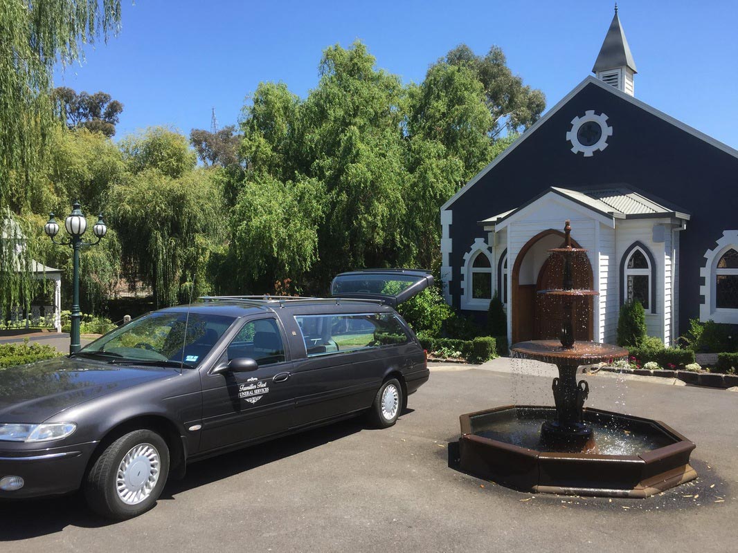 funeral hearse outside church